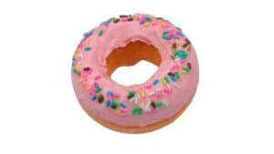 Colorful strawberry donut with sprinkles for magic tricks and illusions.