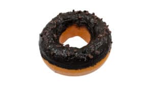 Delicious chocolate cookie donut with rich glaze and sprinkles, perfect for magic tricks and dessert.