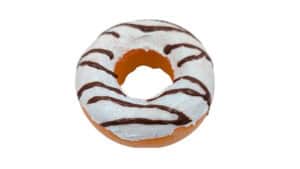 Delicious marble donut with white icing and chocolate drizzle, perfect for magic tricks and visual i.