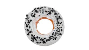 Delicious Cookie and Cream Ultra Donut with black sprinkles, perfect for magic tricks and dessert di.