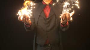 Magical card effect system performed by Menzi Magic and Zhao Xinyi with sparks and illusions.