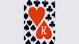 Playing card with heart and spade suits, featuring a large red heart and spade with a 