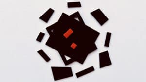 Tangram Paradox Mini puzzle with black and red pieces for optical illusion.
