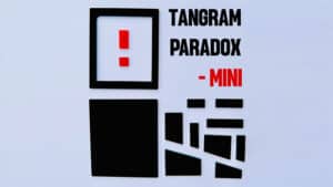 Tangram Paradox Mini puzzle with geometric shapes and exclamation mark.