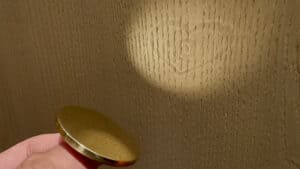 Close-up of the Bronze Enigma magic prop used in the illusion performance.