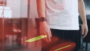 Performer demonstrating a magic trick with a glowing wand for an engaging illusion.