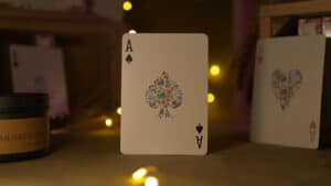 Ace of Spades with floral rose design on a playing card.
