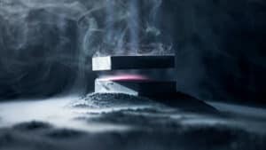 Levitation magic trick with floating magnetic blocks and smoke effect.