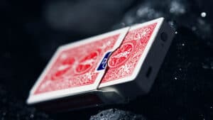 Close-up of Leviti Deck magic trick with cards in mid-air.