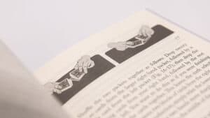 Close-up of a magic trick with cards, demonstrating sleight of hand.