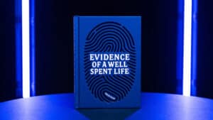 Cover of "Evidence of a Well Spent Life" by Helge Thun, blue fingerprint design.