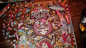 Detailed image of the Grateful Dead themed jigsaw puzzle featuring vibrant colors and iconic band im.