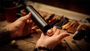 Performing The Chop Tube magic trick with a baseball and tube setup.