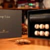 Chop Tube magic prop with baseballs and bat for illusion tricks.