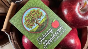 Johnny Appleseed playing cards deck with apple design for magic tricks.