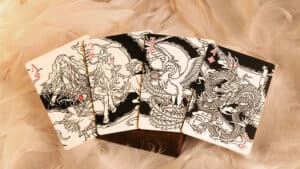 Mythic Divide tarot-style playing cards featuring intricate dragon and mythical creature designs.