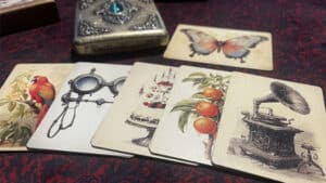 Vintage card deck spread for magic tricks, featuring antique illustrations and mystical props.