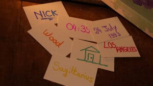 Colorful handwritten notes on paper sheets for magic tricks.