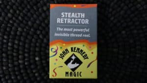 Stealth Retractor magic trick by John Kennedy, invisible thread reel for illusions.