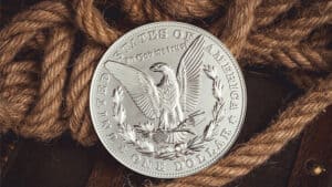 Close-up of a large silver Morgan coin used in magic tricks.