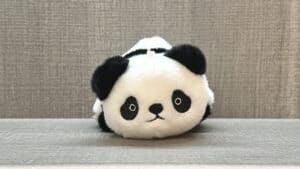 Plush toy transforming from panda to penguin in a magic trick by Jackie Zhao and JT Magic.