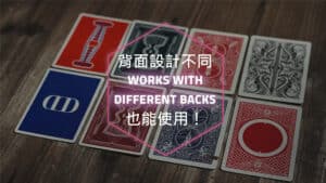 Close-up of playing cards with varied backs for a magic trick performance.