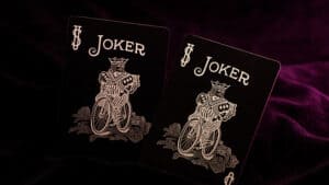 Close-up of Bicycle Reverse Pink Playing Cards featuring a joker design.