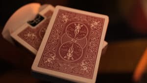 Bicycle Metallic Ruby playing cards with intricate red and silver design.
