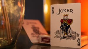 Bicycle metallic ruby playing cards featuring a joker with a bicycle design.