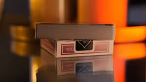 Bicycle metallic ruby playing cards with a reflective surface and vibrant red design.