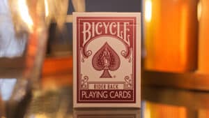 Bicycle Metallic Ruby playing cards with a spade design on the box.