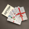 Giftism deck by Deuce Gala Magic showcasing a deck of playing cards with a festive design and red ri.