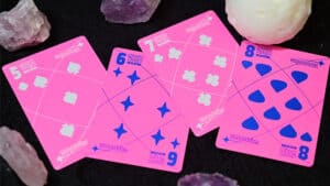 Pink Moon playing cards with unique designs for magic and card tricks.