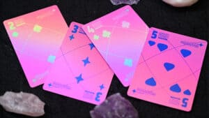 Pink holographic moon-themed playing cards for magic and card tricks.