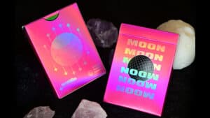 Pink holographic Moon-themed playing cards for magic tricks and card illusions.