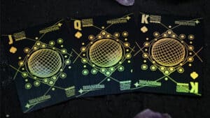 Black holographic Moon playing cards with futuristic design for magic performances and card tricks.