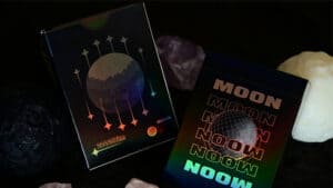Black holographic moon-themed playing cards for magic tricks and card illusions.