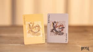 Playing Cards Featuring Bicycle Mascot and Snake Design.
