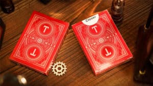 Olson's Closer card trick with red deck and gear prop for magic performance.