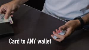 Person performing a magic card trick with a deck of cards.