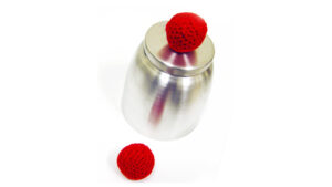 Metal chop cup with red crochet ball for magic tricks.