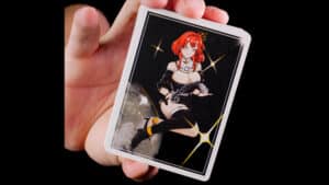 Queenie playing card featuring anime-style character with guitar, perfect for magic and card tricks.