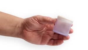 Hand holding FartBag, a humorous fart sound maker toy.