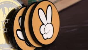 Poker chips with a peace sign symbol for winning prediction.