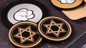Prediction coins with star and brain symbols for magic tricks and mentalism.