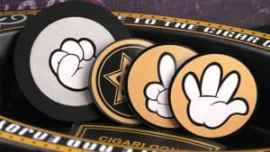 Close-up of prediction cards and props used in a magic trick performance.