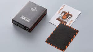 Slander playing cards deck with black and orange design for magic tricks and card illusions.