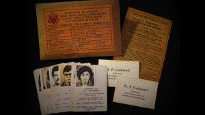 Vintage secret government documents and ID cards from Gemini Files magic trick.