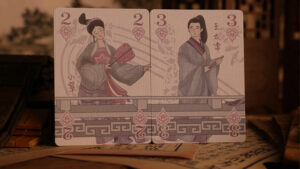 Traditional Chinese playing cards with artistic illustrations for magic tricks.