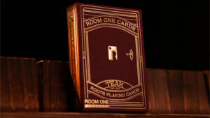 Room One Teak Edition playing cards with intricate design and red roots theme.